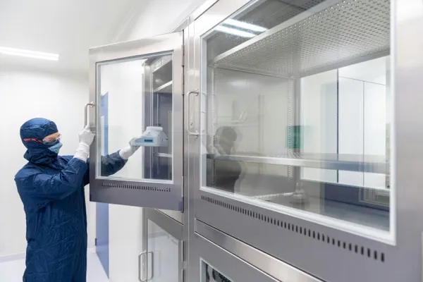 Worker at cleanroom chamber