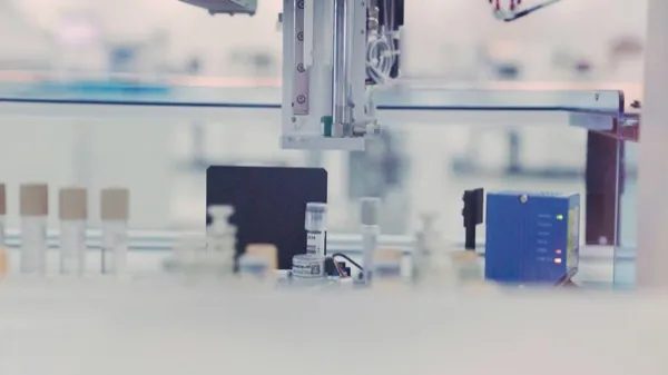 Automated lab equipment with vials